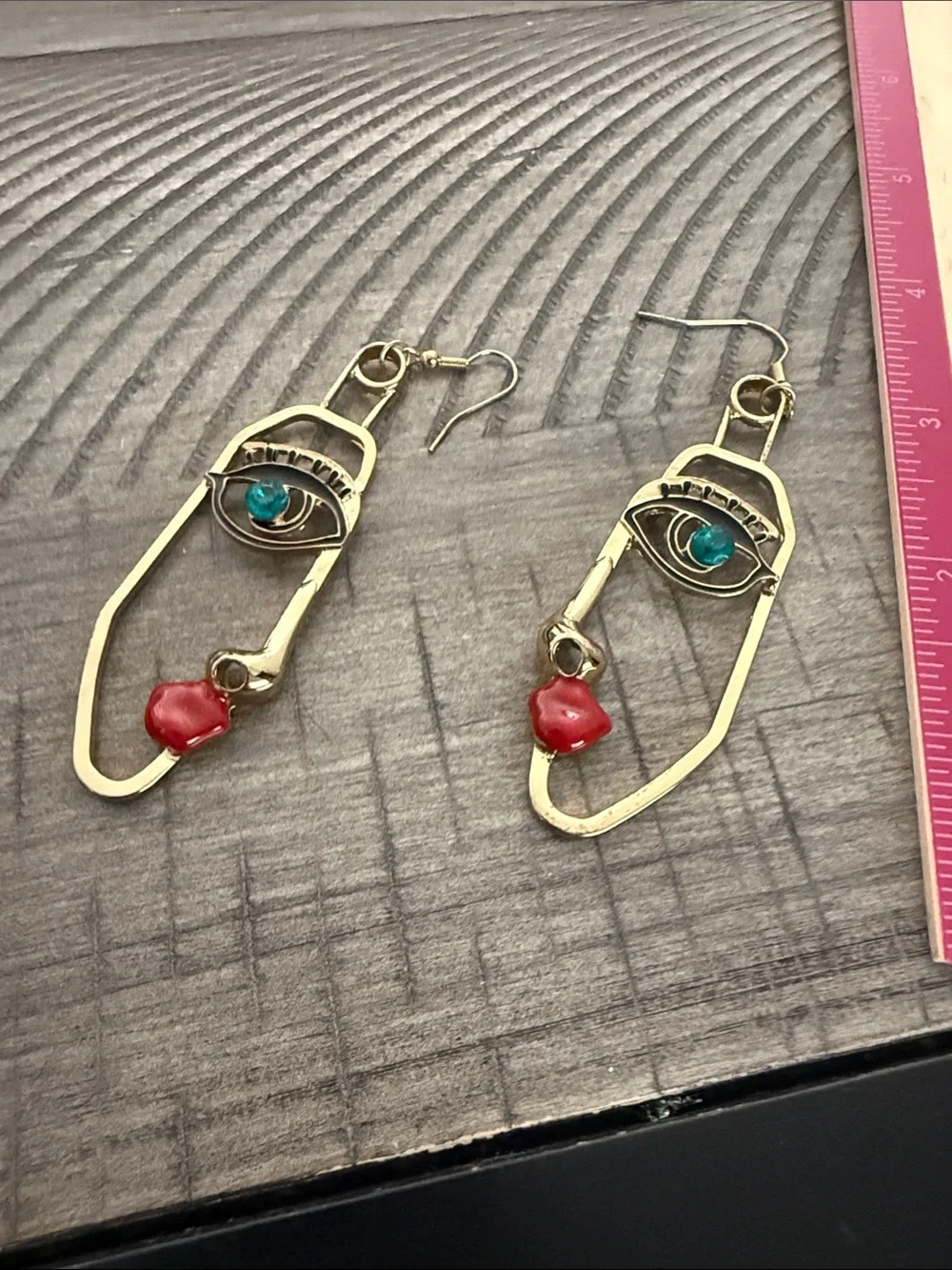 Gold Face Outline Drop Earrings with Blue and Red Accents
